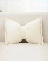 Cream Bow shaped cushion including insert 30 x 50 cm